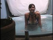 Sexy couple having sex in a hot tub
