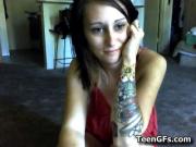 Horny tatooed teen teasing the web cam